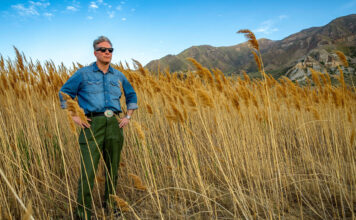 He’s not a scientist. But he’s on a mission to save the Great Salt Lake — one piece of clothing at a time. Chris standing among the phragmites