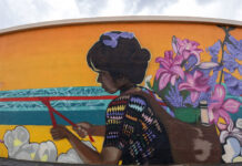 In photos: SLCC alum’s ‘Vida Del Valle’ mural expands public art in West Jordan Photo of mural painted on curved wall of a water tank