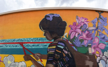 In photos: SLCC alum’s ‘Vida Del Valle’ mural expands public art in West Jordan Photo of mural painted on curved wall of a water tank
