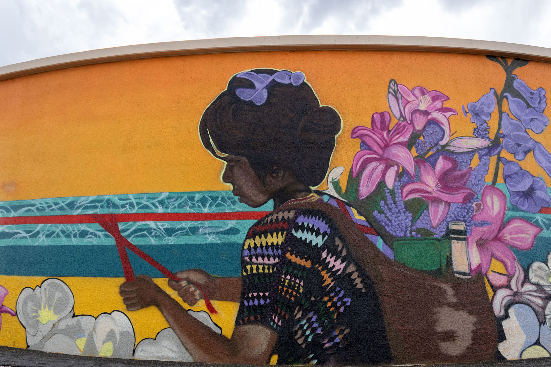 Photo of mural painted on curved wall of a water tank
