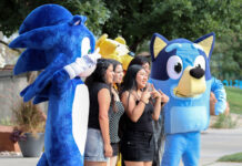 In photos: Bruin Bash welcomes Bruins back in style Festivalgoers posing for a photo with mascots