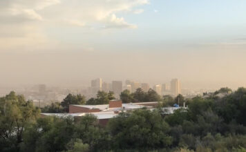 How U can identify and protect yourself from Great Salt Lake dust storms Cityscape shrouded by dust under a blue sky