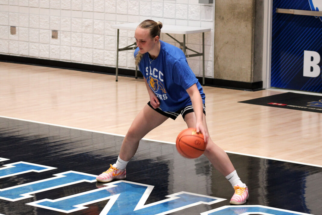 Joss dribbling a basketball on the court