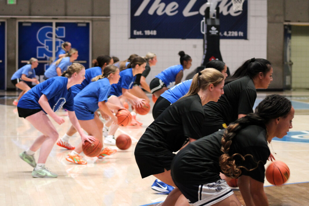 Basketball players participating in a dribbling exercise