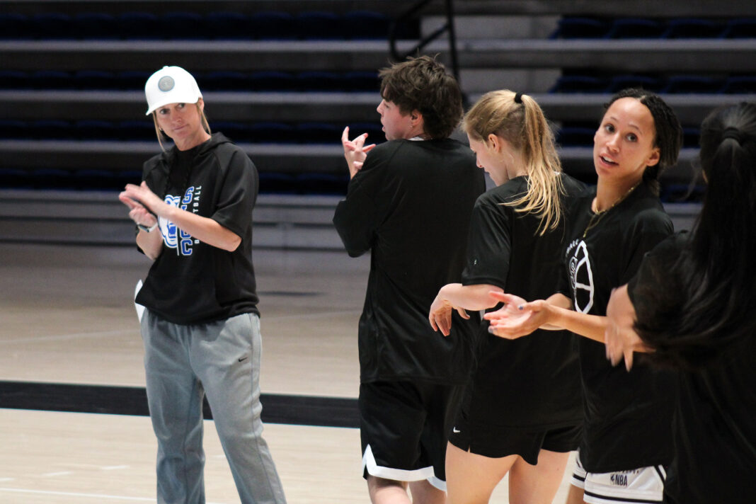 Coach Newton gathering the players together during a practice