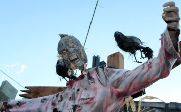 In photos: Inside Utah’s only underground haunted house An evil looking scarecrow with crows perched on its shoulders