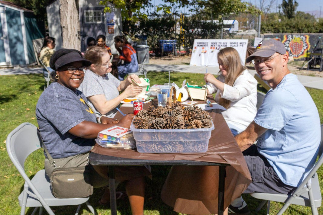 Several people smiling and celebrating a successful growing season