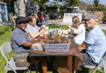 In photos: Fall Garden Party celebrates successful growing season Several people smiling and celebrating a successful growing season