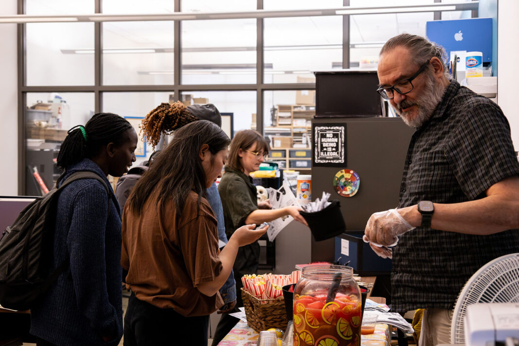 Landscape photos of students viewing the Publication Centers information and snack table