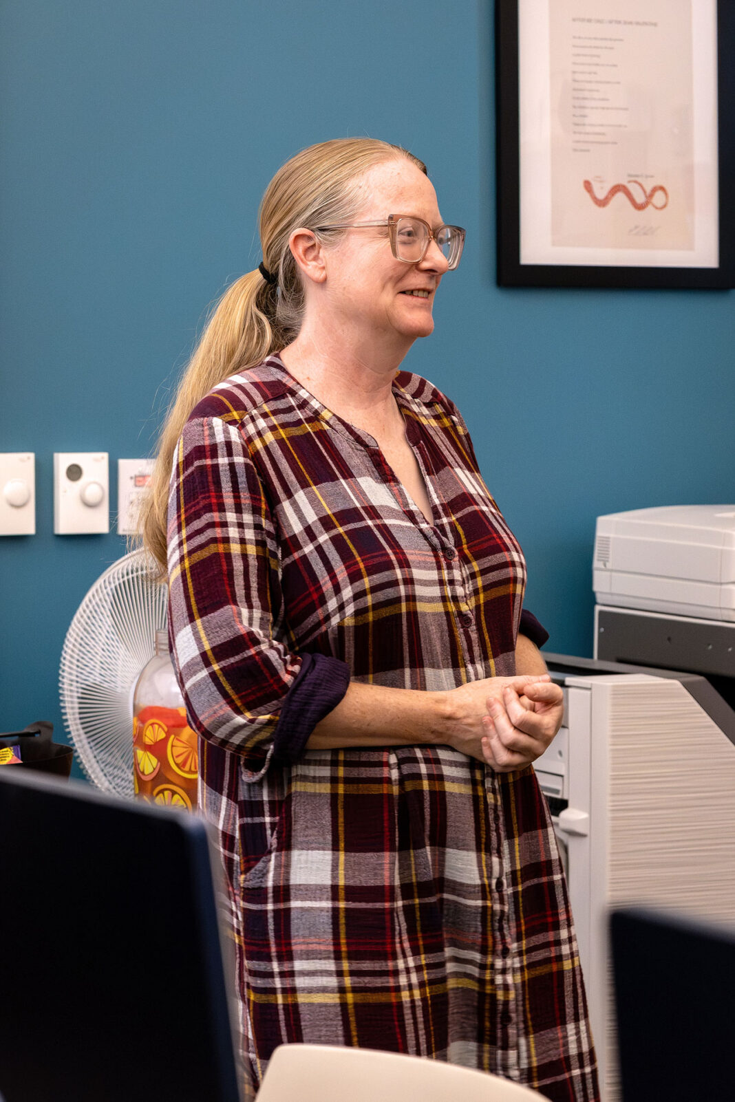 Portrait style photo of Brenda Sieczkowski presenting dedication to Ken Nelson