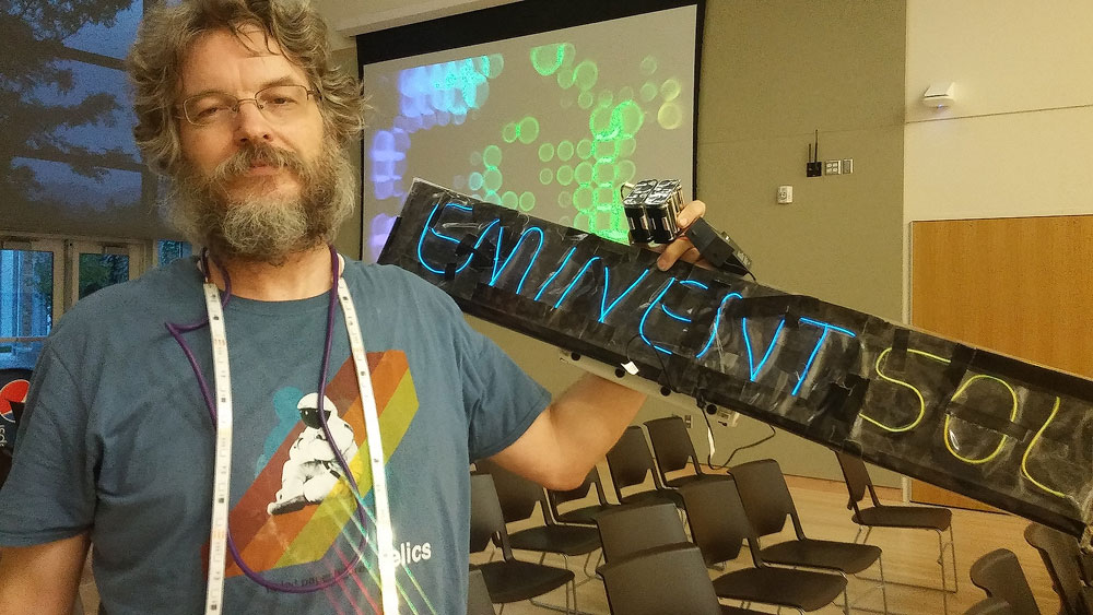 Fan-made sign lights up world video premiere John Peterson