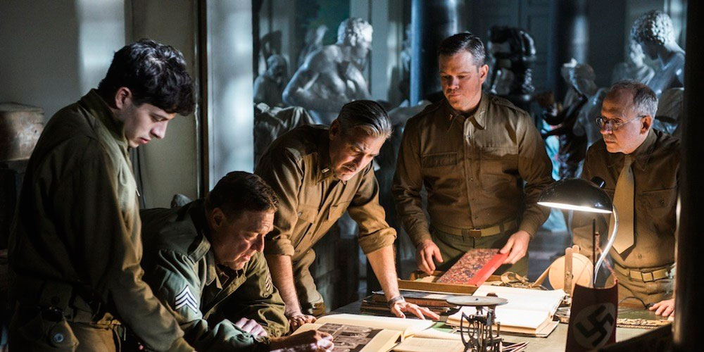 Movie Review: ‘The Monuments Men’: Laying down lives for the sake of art Still from The Monuments Men featuring Dimitri Leonidas, John Goodman, George Clooney, Matt Damon, and Bob Balaban.