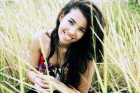 Student Profile: Juliet Devette Juliet Devette sitting in tall grass