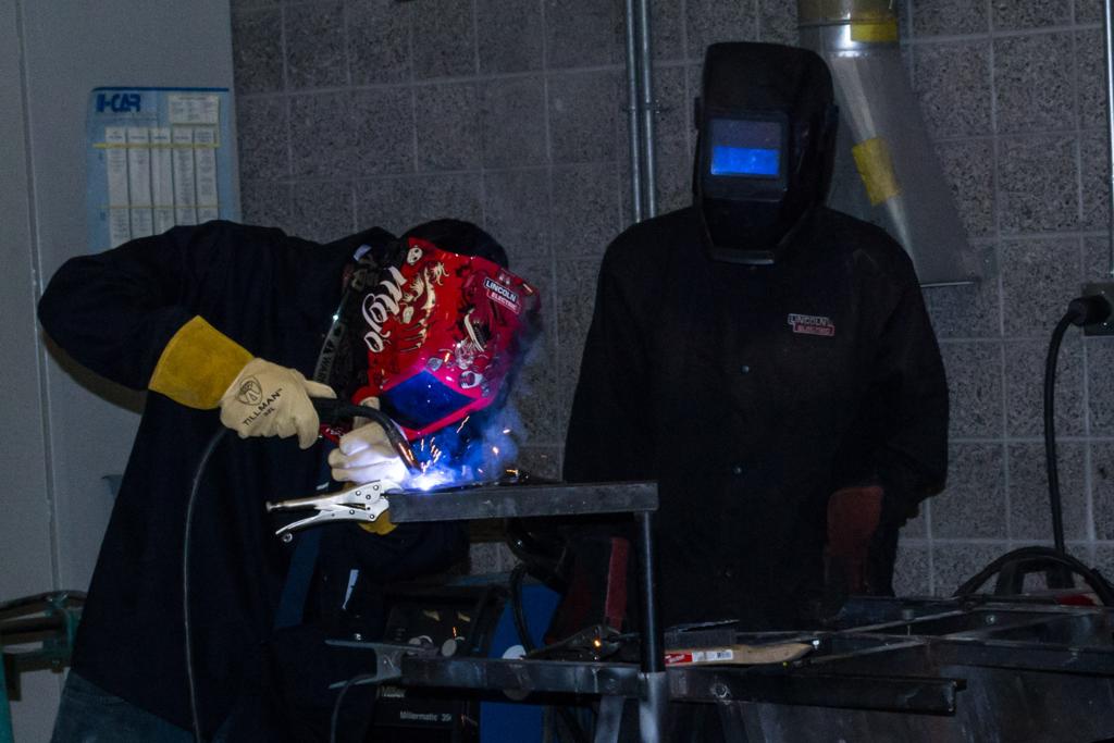 Affordable auto repair at Salt Lake Community College Dante Overstreet (left) and Brandon J. Ward (right) learning to weld.