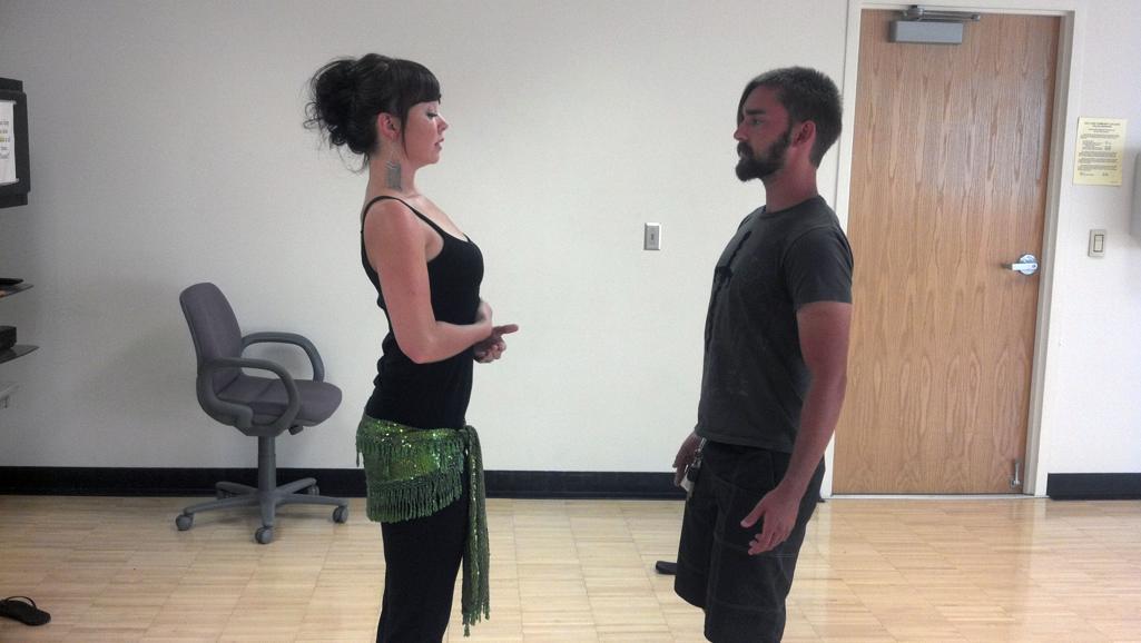 For the adventurous, belly dance offers a different kind of fine art credit Belly dance instructor Annie McIntire teaches student Bruce Daw the correct belly dance posture.