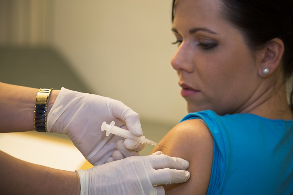 In wake of measles outbreak, Health and Wellness Services encourages vaccinations Woman receives an immunization