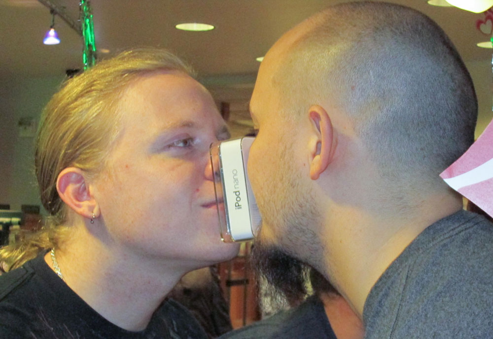 Couples kiss for iPod at SLCC Sam Crawford and Zach Frew