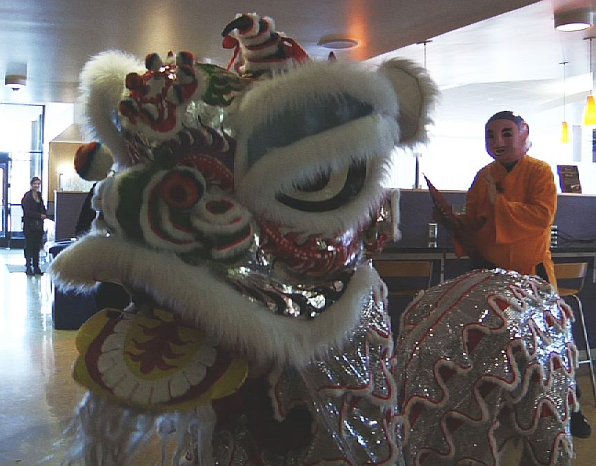 Lions and speakers and meals, oh my A lion spreads good luck at the Taste of Asia event at the Taylorsville Redwood Student Center.