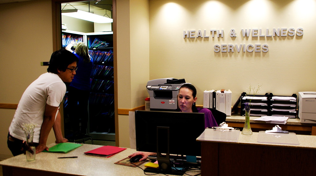 Possible measles outbreak at SLCC Health and Wellness employee Angie Volner, right, and student Sukhee Han