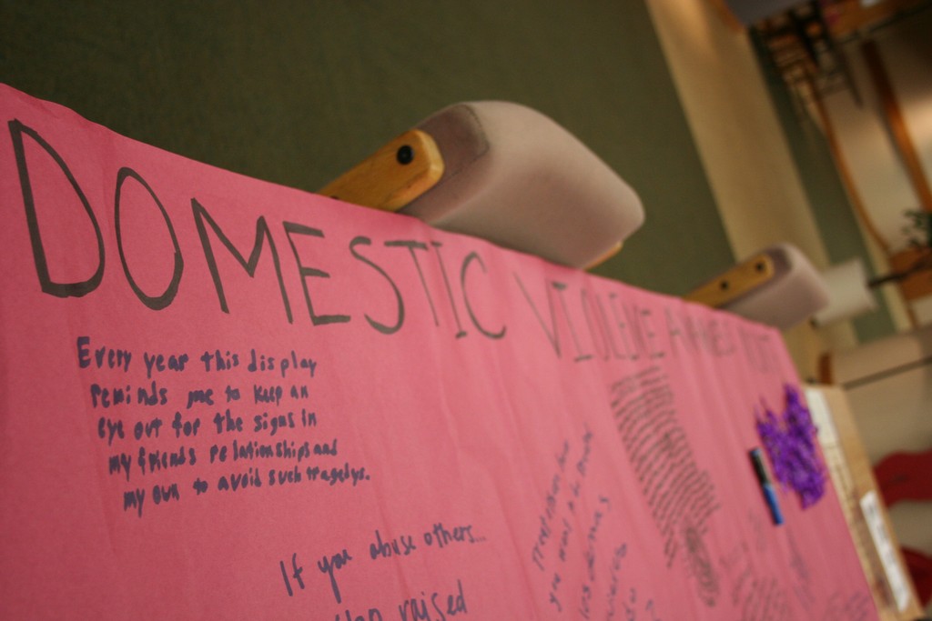 Silent Witness: domestic violence awareness comes to SLCC campuses Students write their thoughts about domestic violence during the Silent Witness display at Taylorsville Redwood Campus.