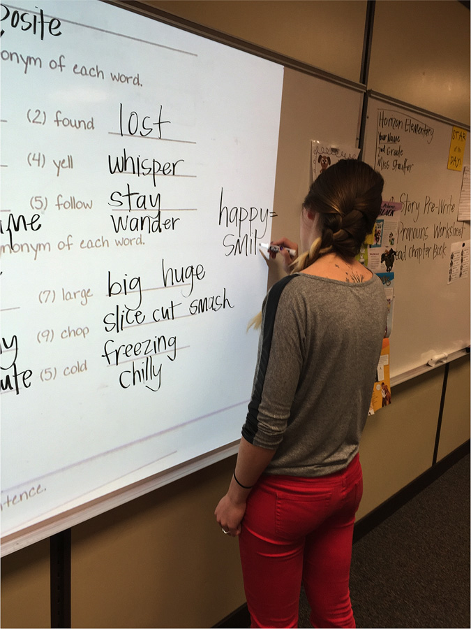 Teacher predicts destiny in elementary school Tiana Stauffer writes on a whiteboard