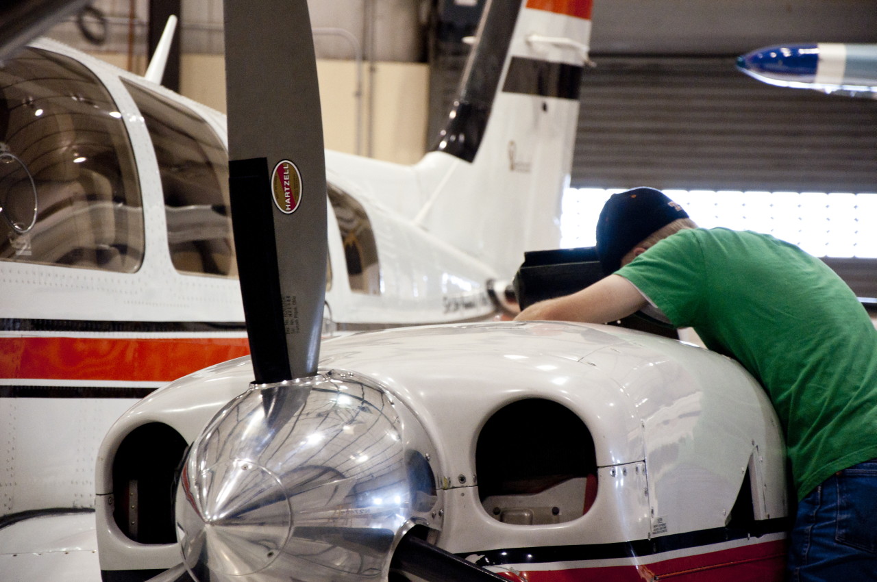 Aviation Maintenance keeps the skies running Aviation student works on engine