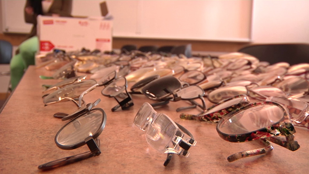 Comm 1010 classes work to improve sight for Uganda Pairs of eyeglasses on a table