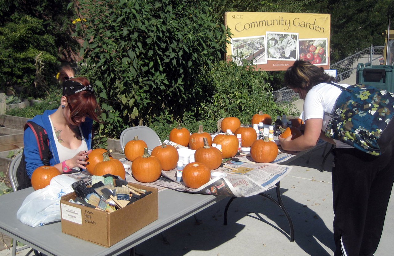 SLCC Community Garden continues to grow Two SLCC students paint pumpkins