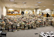 Markosian Library to undergo renovation Books stacked on the library floor