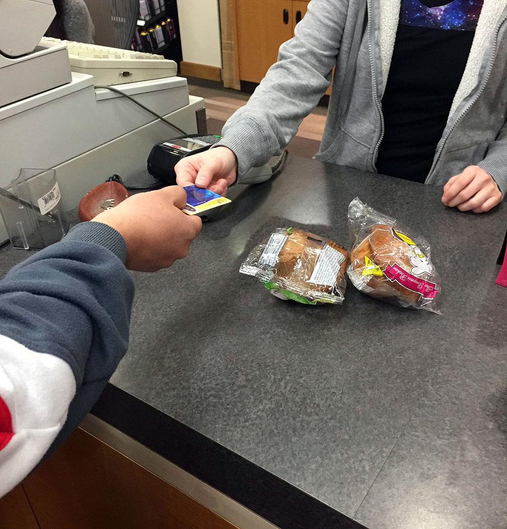 OneCard useful for financial aid, other services Buying food with a OneCard