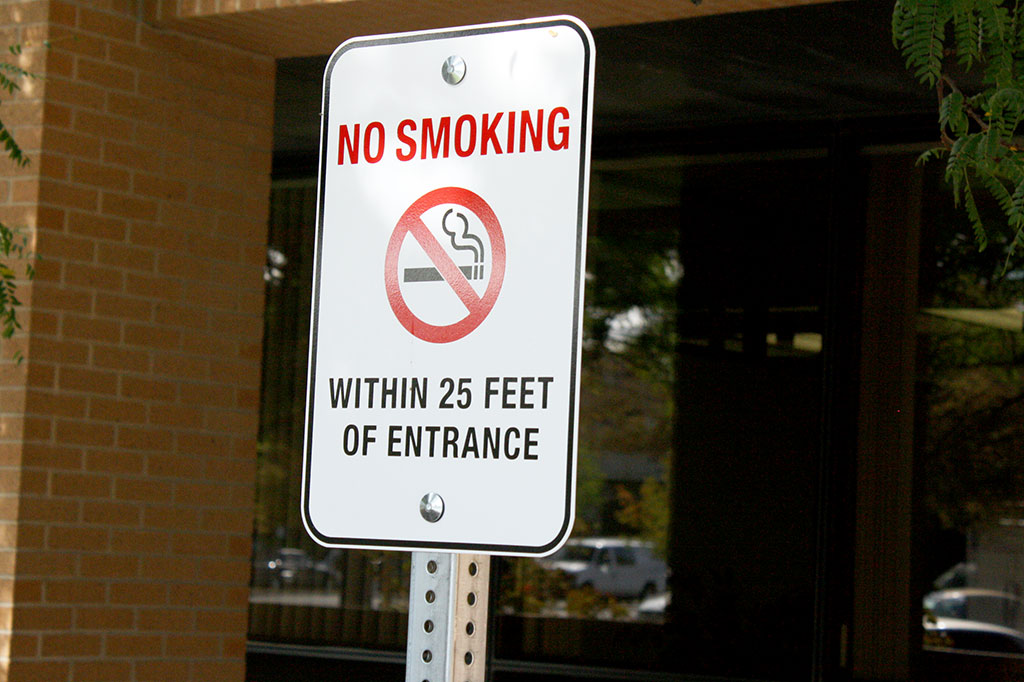 Utah smoking laws force e-cigarette users outside No smoking sign