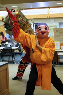 Students learn Mongolia is more than a just place on the map Traditional Lion Dancers lead crowd into Taste of Asia event.