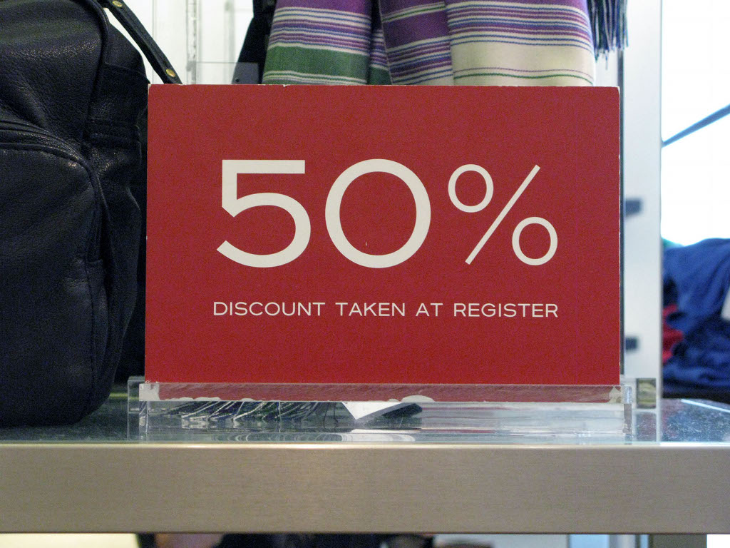 Black Friday: corporate brainwashing, or turkey coma-induced madness? 50 percent off sign in a department store