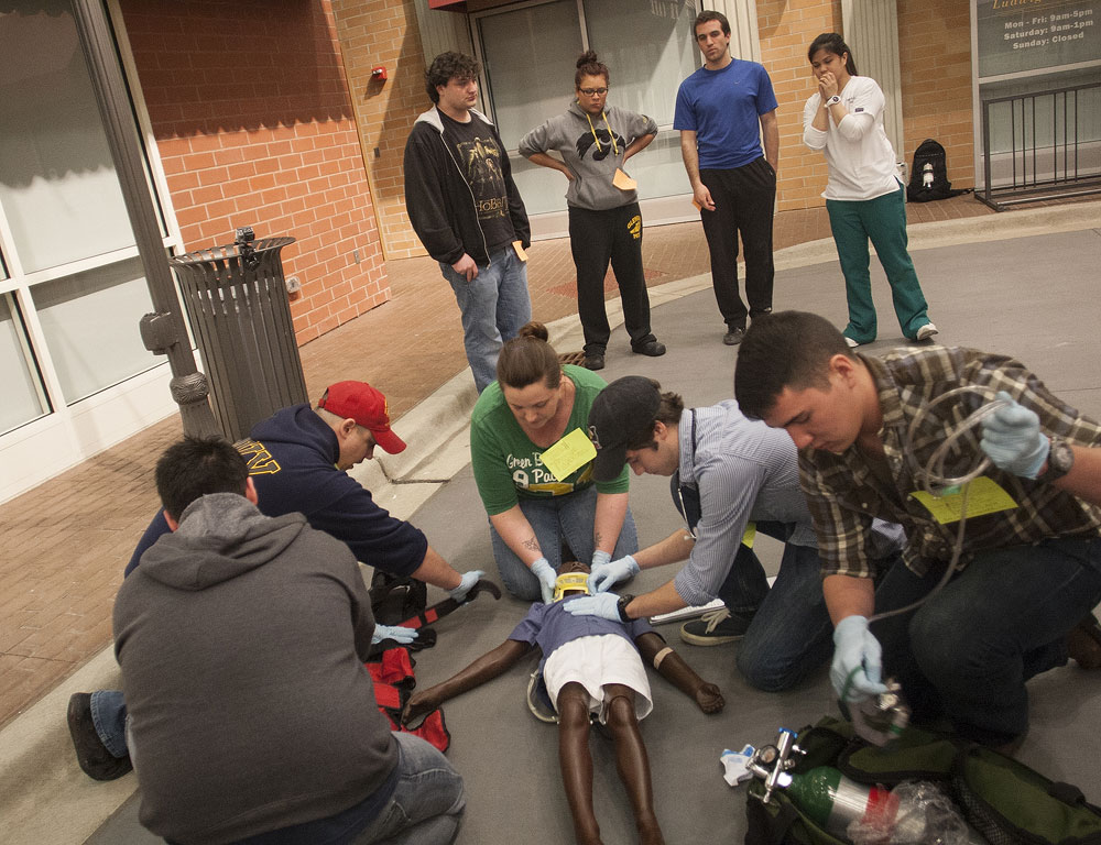 SLCC EMT students learn how to save lives EMT students stabilize a patient