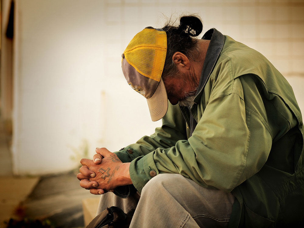 Volunteering in Salt Lake: 6 ways to help Homeless man with head down