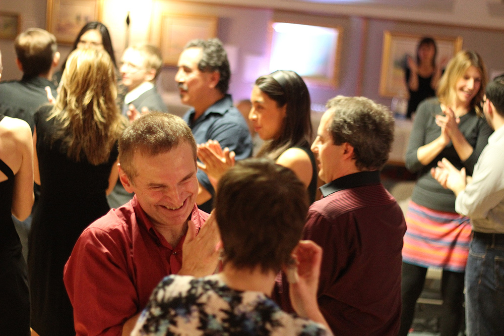 Step out of your comfort zone — learn to tango Couples applaud after the dance