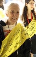 Photo of an elderly woman participating in the International Women's Day march