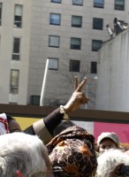 Photo of a peace sign hand gesture during International Women's Day