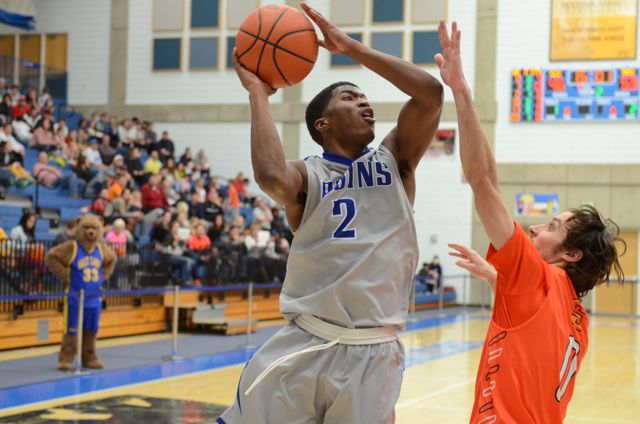Men’s Basketball continues to dominate league Tyrell Corbin slashes to the basket and finishes strong.